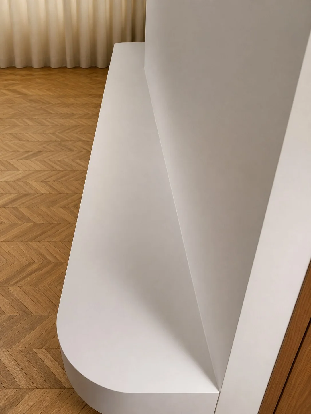Détail arrondi du meuble TV blanc sur mesure